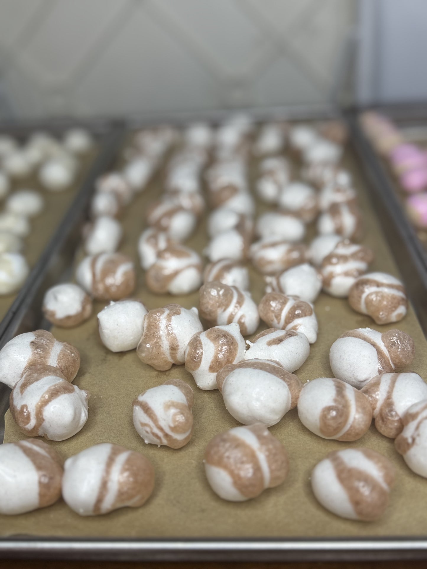 Freeze Dried Candy, displaying candy on tray, salt water taffy, cinnamon roll flavour